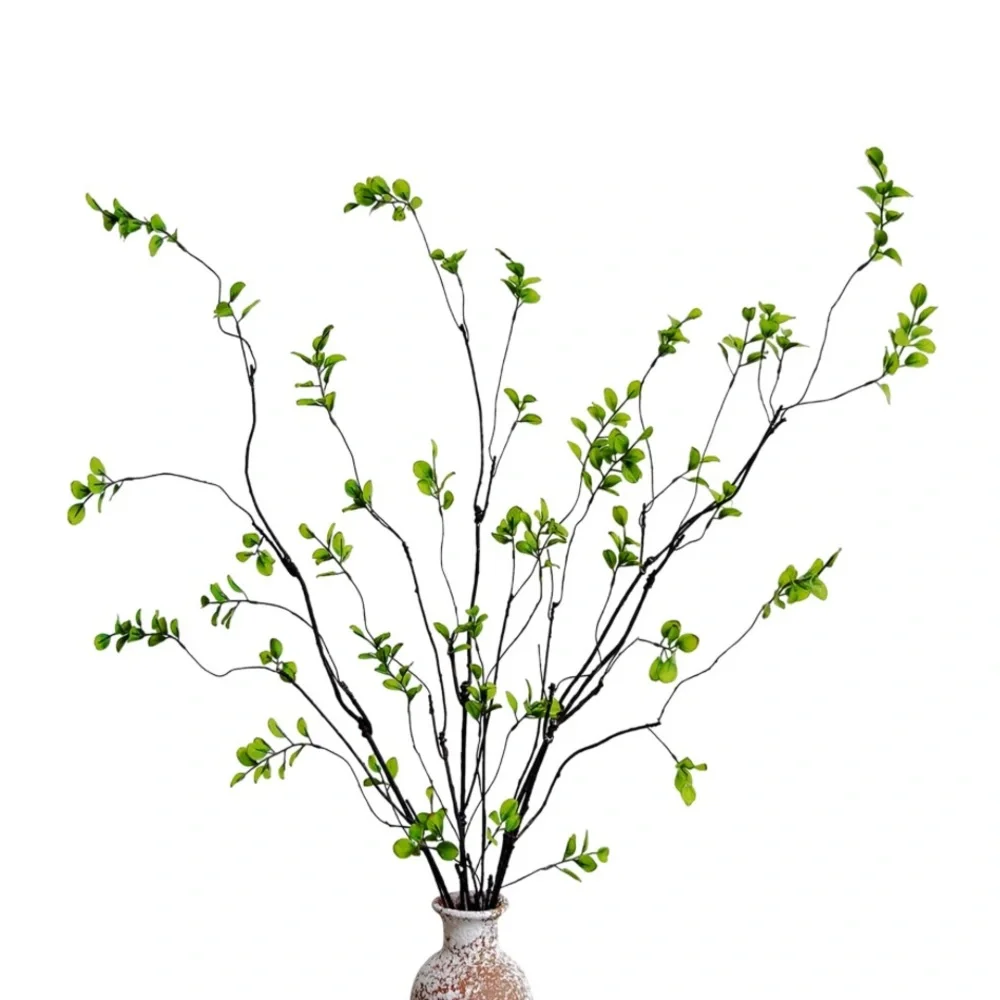 Lush Green Faux Plant in Artistic Vase